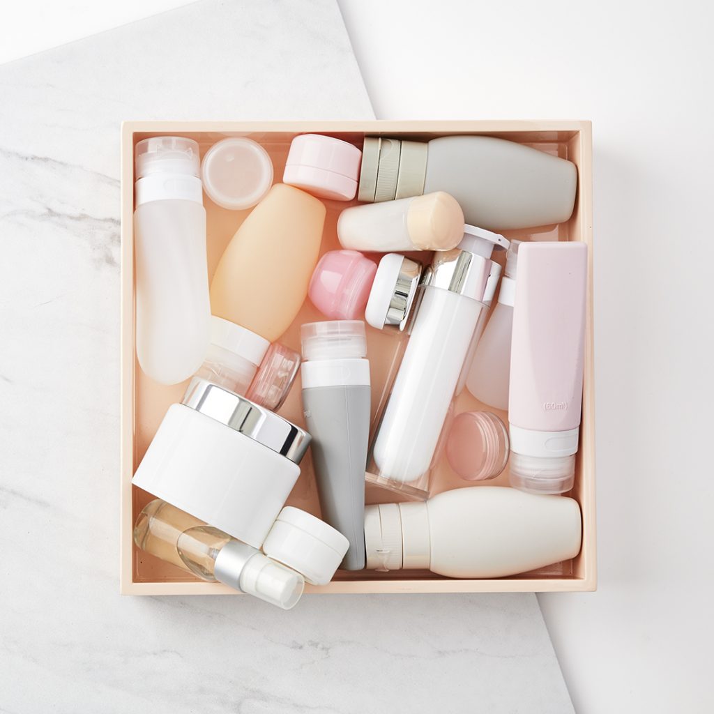 Box of assorted skincare product bottles