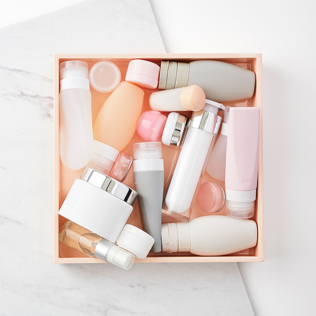 Box of assorted skincare product bottles