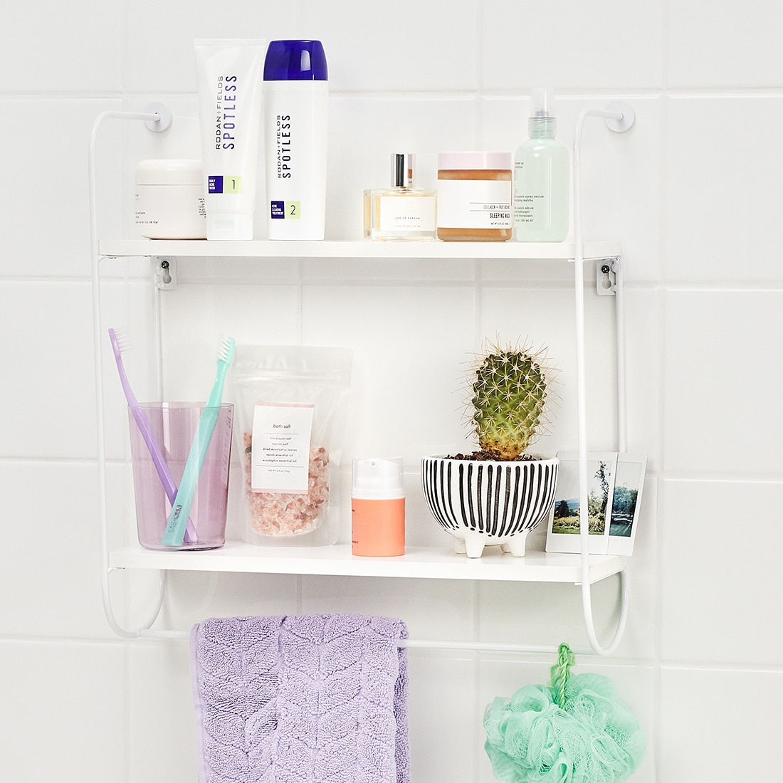 Spotless acne regimen shown on shower shelf with misc shower items