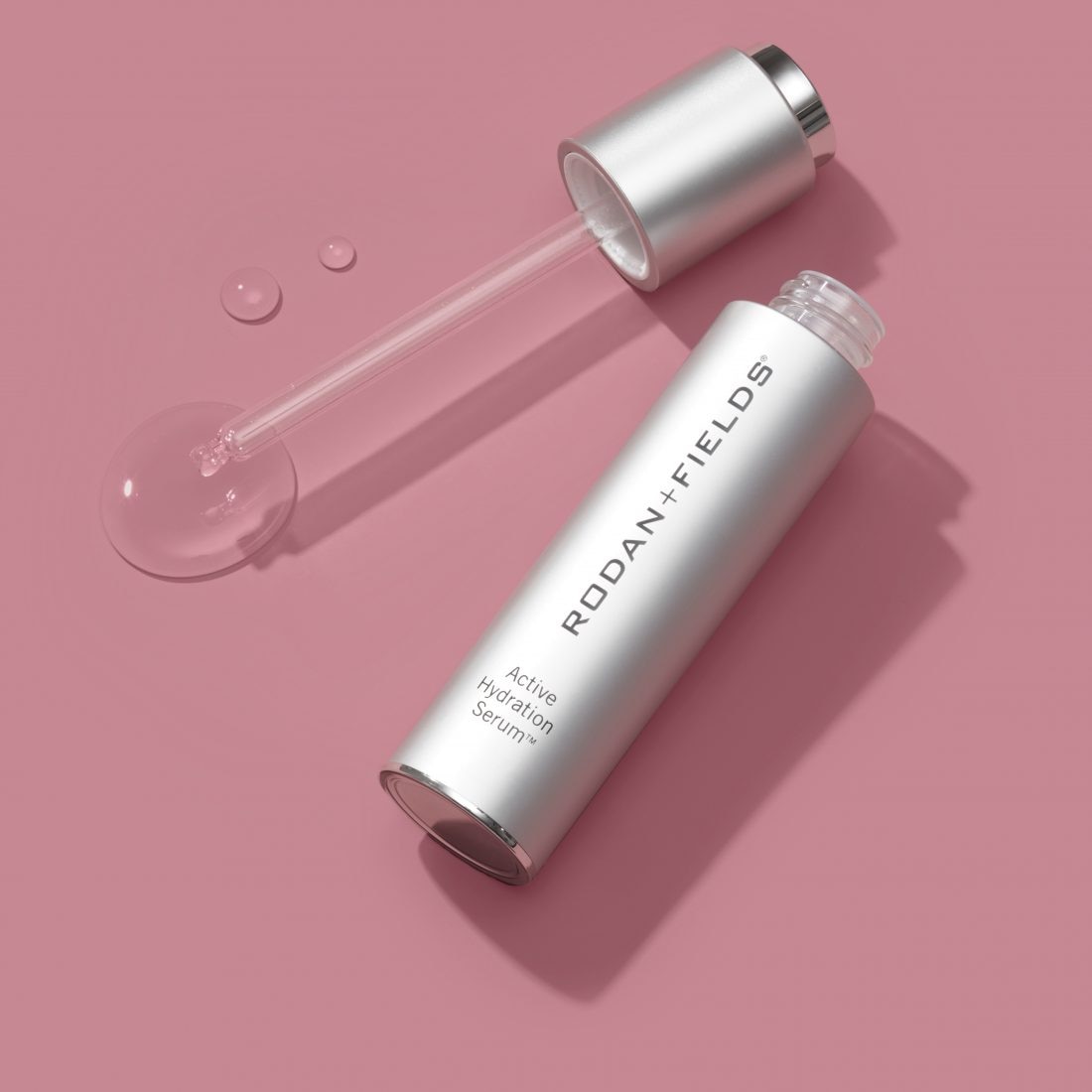 Open bottle of Active Hydration Serum showing texture droplets