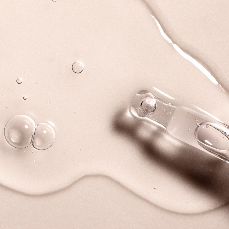 Close up of glass applicator tip showing Hyaluronic Acid serum texture