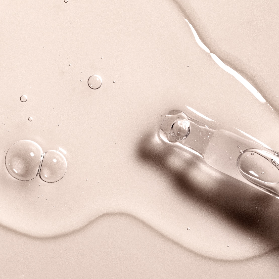 Close up of glass applicator tip showing Hyaluronic Acid serum texture