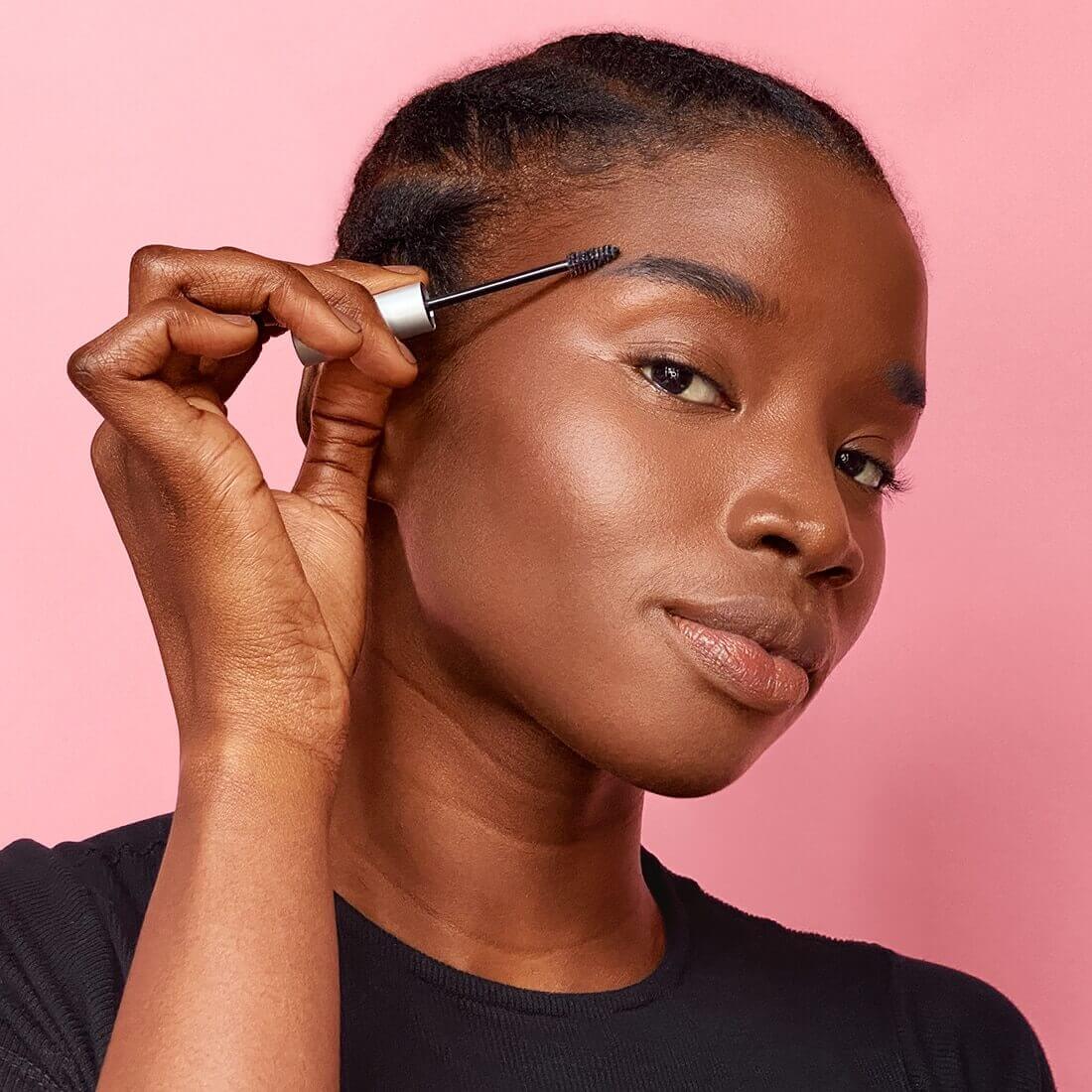 Woman applying Brow Defining Boost