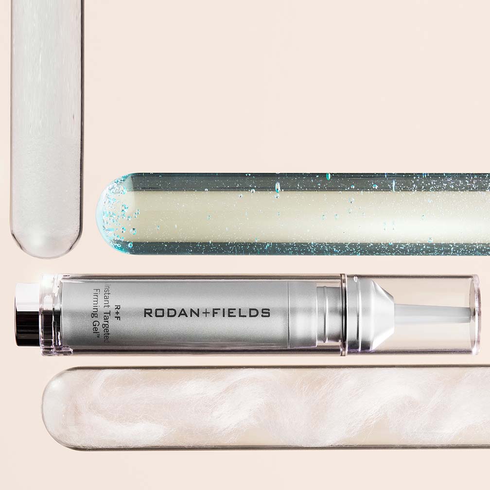 Vial of R+F Instant Targeted Firming Gel alongside glass test tubes of serum