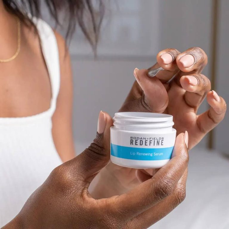 Woman holding an open container and a capsule of Rodan + Fields Lip Renewing Serum