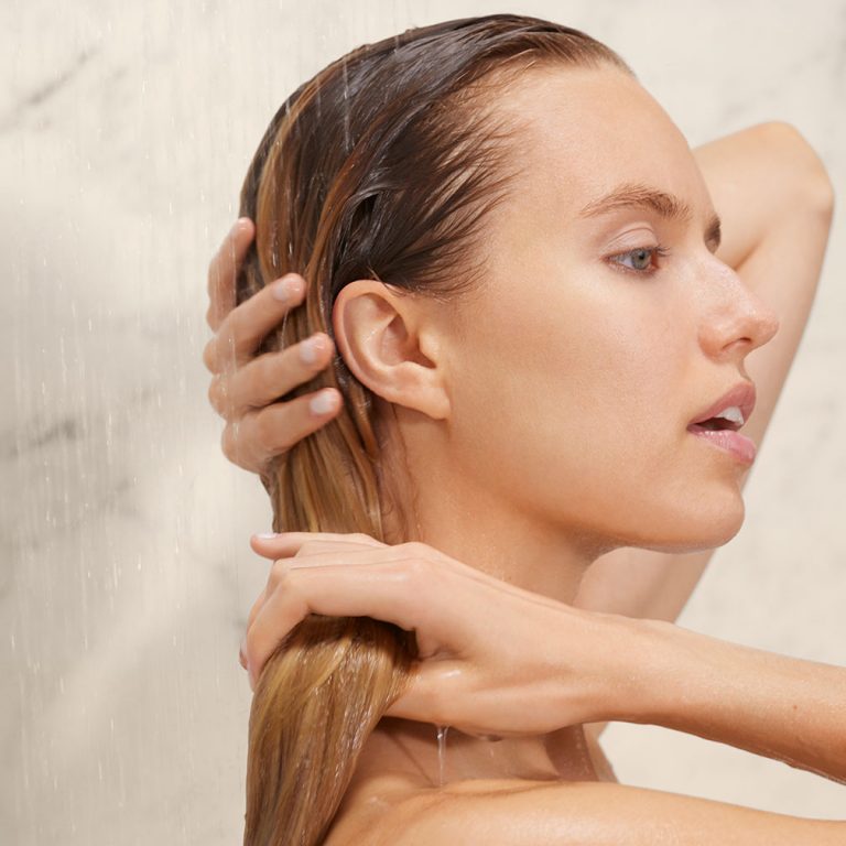 Closeup of woman washing her hair.