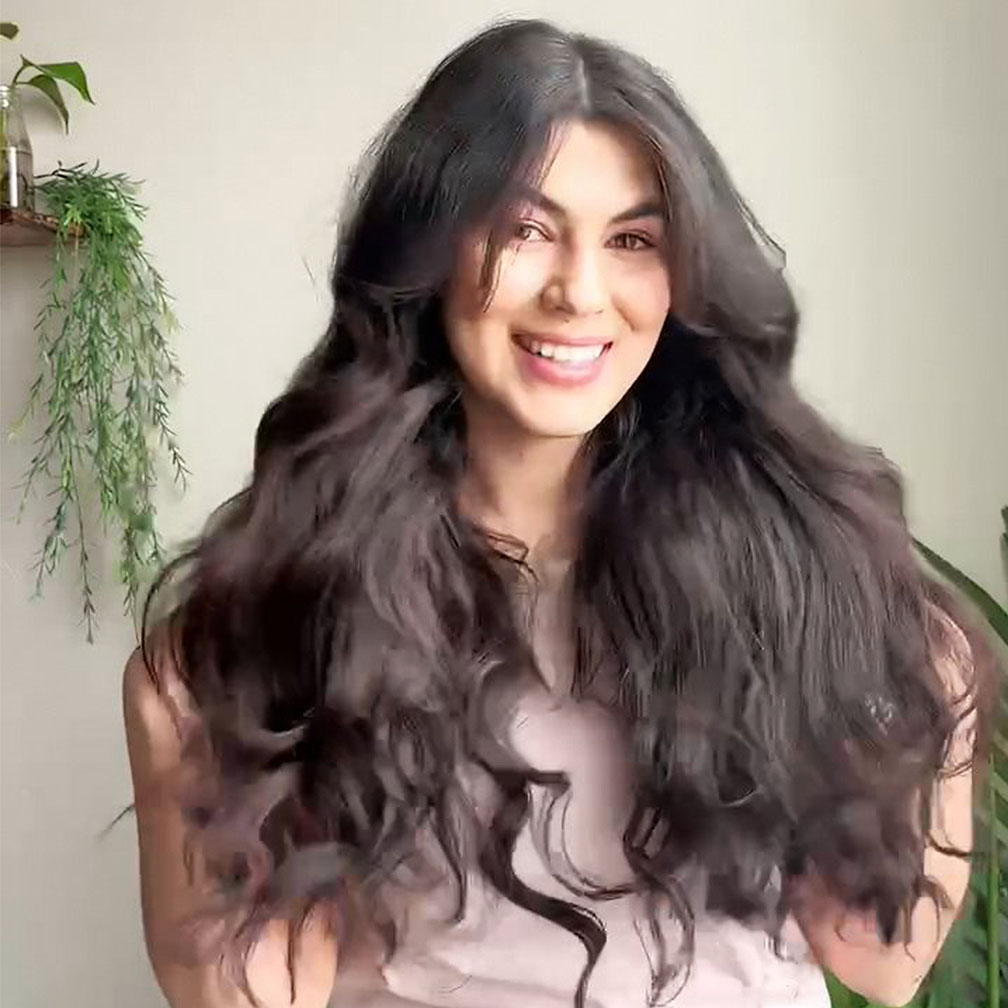 Isabelle Casado demonstrates how to achieve heatless curls with Rodan + Fields Define Curl Cream
