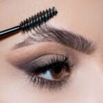 Closeup of woman applying Eyebrow Tint