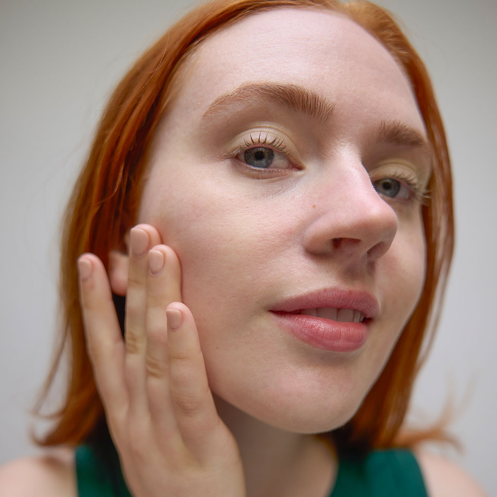 Young woman applying Hydra Mask Gel Cream to her face