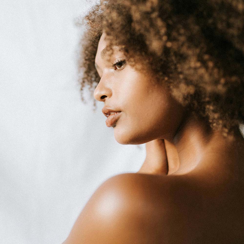 Young woman glowing skin. Photo by Huha Inc.