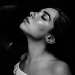 Young woman with eyes closed with head back. Black and white. Photo by Zulmaury Saavedra