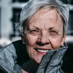 Older woman in a pea coat. Photo by Ravi Patel.