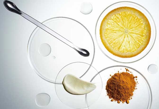 Glass petri dishes containing raw skincare ingredients. Glass petri dishes containing raw skincare ingredients.